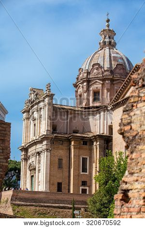 Rome, Italy - April, 2018: Tourists Visiting The Basilica Of Maxentius And Constantine At The Roman 