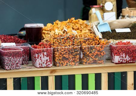 Berries On The Market Counter-autumn Market. Gifts Of Autumn.