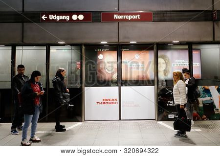 Copenhagen, Denmark - September 4, 2019: People Waiting At The Norreport Station Platform Gates For 
