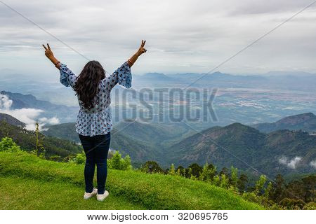 Girl Isolated Soaking Natural Beauty From Hill Top Image Is Showing The Human Love Towards The Natur