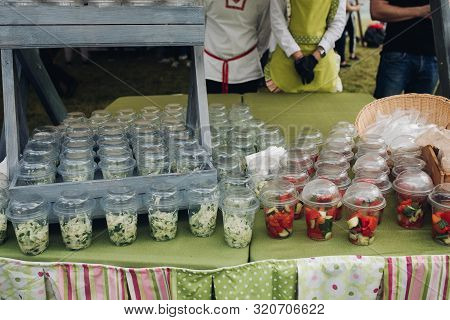 Organic Veggies In Cups To Go.close-up Of Loads Of Plastic Cups Filled With Chopped Vegetables And S