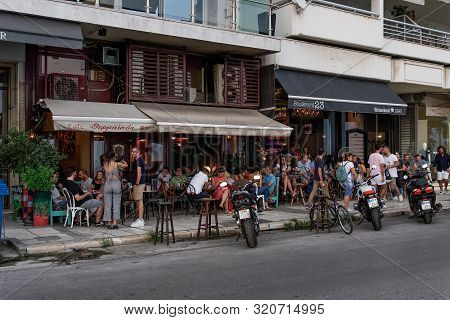 Thessaloniki, Greece - August 15 2019: People Enjoy Coffee At City Center Cafe Bars. Unidentified Cr