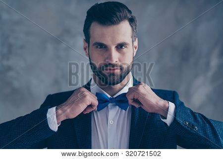 Close Up Photo Of Elegant Man Looking Into Mirror Correcting His Bowtie Wearing Blazer Jacket Isolat
