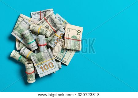 Stacks Of One Hundred Dollars Banknotes Close-up On Colored Background Business Concept Top View Wit