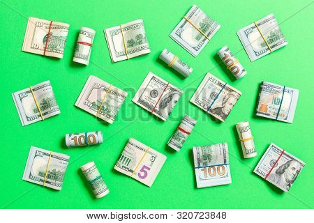 Colored Background With Money American Hundred Dollar Bills On Top Wiev With Copy Space For Your Tex
