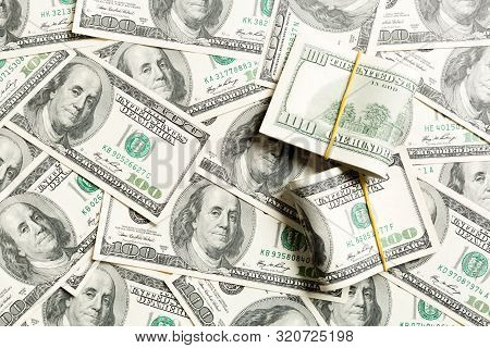 Stacks Of One Hundred Dollars Banknotes Close-up On Dollar Background Business Concept Top View With