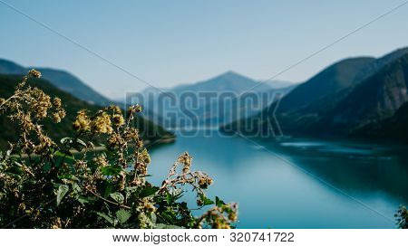 Zhinvali Reservoir Lake Landscape With Mountains . The Main Caucasus Ridge.