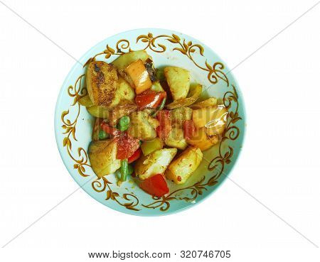 Punjabi  Shimla Mirch Aloo, Indian Dish Prepared With Potatoes And Green Pepper Cooked In A Tomato G