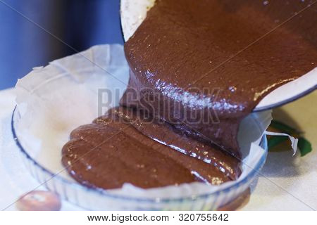 Chokolate Dough For Cake In Cooking Process With Mixer In Bowl Close Up Photo
