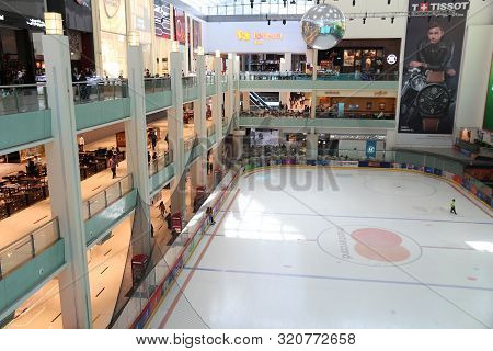 Dubai, Uae - November 22, 2017: Shoppers Visit Dubai Mall. It Is The Largest Mall In The World By To