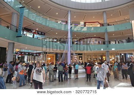 Dubai, Uae - November 22, 2017: Shoppers Visit Dubai Mall. It Is The Largest Mall In The World By To