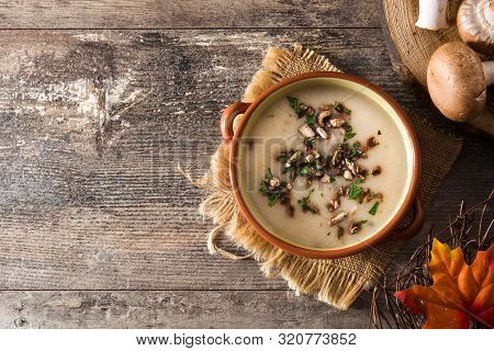 Homemade Mushroom Soup In Bowl On Wooden Table. Top View. Copy Space