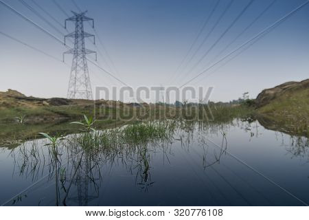 Electrical High Voltage Power Lines At Purulia, West Bengal, India With Blue Sky Background. Electri