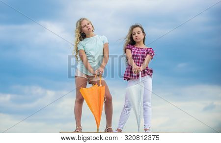 Ready For Any Weather. Girls Friends With Umbrellas Cloudy Sky Background. Windy Or Rainy We Are Pre