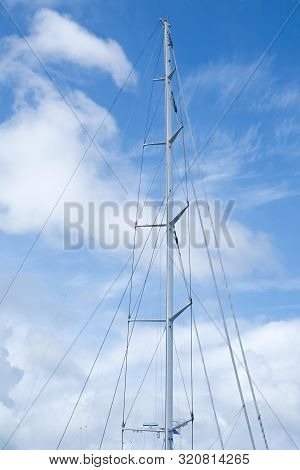 The Mast Of A Big Sailing Vessel Against The Blue Sky