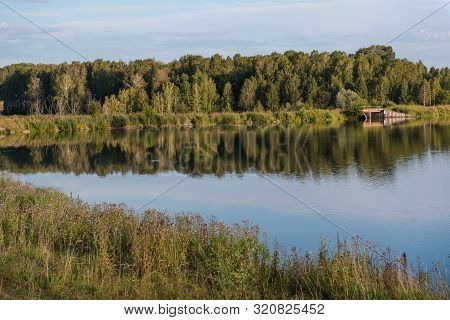 Small Lake In The Forest. Lake In Russia. To Fish On The Lake. Beautiful Landscape. Admire The Lake.
