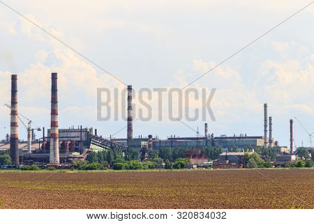 Industrial Landscape. View Of Factory In Nikopol, Dnepropetrovsk Region. Nikopol Ferroalloy Plant Is