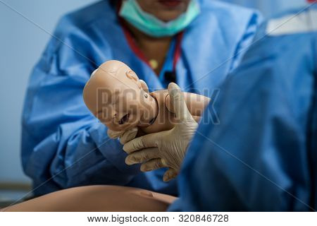 Details With Plastic Dummies Representing A Woman And Her Newly Born Baby Used By Medics And Midwive