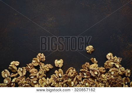 Heap Of Raw Peelled Organic Walnuts. Top View With Copy Space.