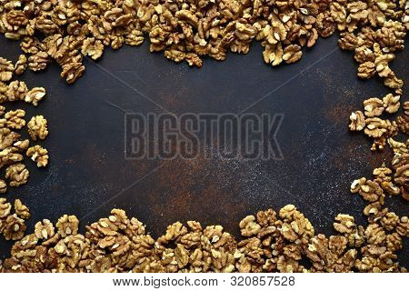 Heap Of Raw Peelled Organic Walnuts. Top View With Copy Space.
