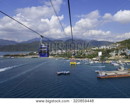 Ropeway Or Cableway Above The Sea, Dark Blue Cabin On Funicular