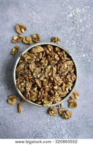 Bowl Of Peelled Walnuts. Top View With Copy Space.
