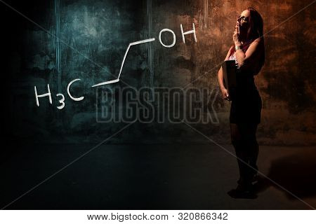 Sexy Girl Or Secretary Or Female Student Presenting Handdrawn Chemical Formula Of Propanol N-propano
