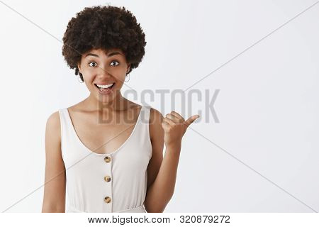 Excited Woman Sharing Incredible Offer With Friend. Excited And Impressed Good-looking African Ameri