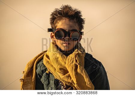 Post-apocalyptic Boy Outdoors In The Desert. Nuclear Post-apocalypse. Life After Doomsday Concept. D