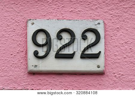 Residential House Number On Pink Facade Wall
