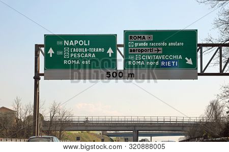 Large Highway Road Sign With Directions To Reach The Italian Cities Of Rome, Naples, Pescara, And Ot