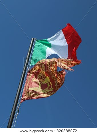 Italian Flag And The Flag Of Venetian Al So Called Bandiera Del Veneto With Winged Lion Of Saint Mar