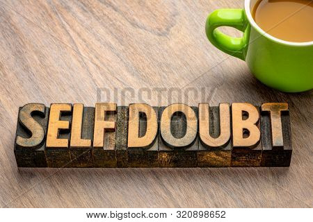 self doubt - word abstract in vintage letterpress wood type, personal development and confidence concept