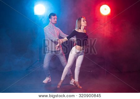 Social Dance, Kizomba, Salsa And Semba Concept - Young Beautiful Couple Dancing Bachata Or Salsa In 
