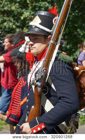 Moscow - June 2015: Portrait of a man in the form of a soldier during the war with Napoleon. Reconstruction of suits at the beginning of the 19th century.