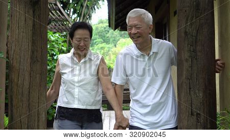 Happy Asian Senior Elder Hide And Seek Playful