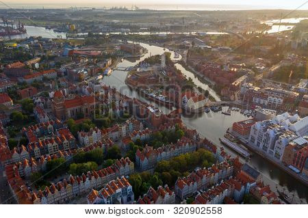 Gdansk Is A City In Poland. Gdansk In The Morning Rays, The Sun Is Reflected From The Roofs Of The O