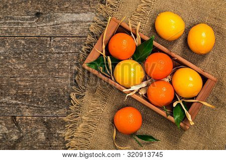Mandarin And Lemon Oranges. Meyer Lemon Hybrid Citrus Fruit Native To China. Selective Focus.