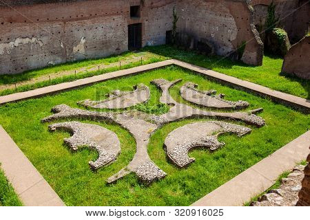 Courtyard Garden Of The Ancient Ruins Of The Domus Augustana On Palatine Hill In Rome