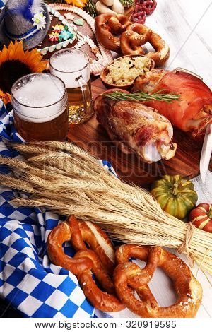 Traditional German Cuisine, Schweinshaxe Roasted Ham Hock. Beer, Pretzels And Various Bavarian Speci
