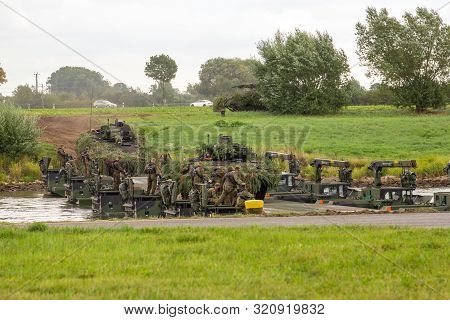 Minden / Germany - September 4, 2019: Panzerpionierbattaillon Trained A Tank Crossing Over A River W