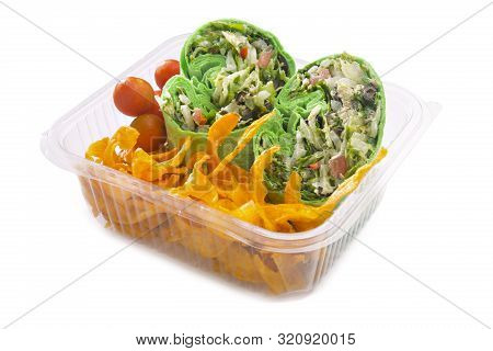 Vegetable Wraps With Cherry Tomatoes And Sweet Potato Chips In Plastic Takeaway Container.
