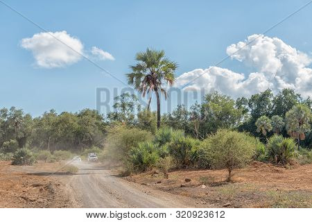 Kruger National Park, South Africa - May 15, 2019: The Landscape On The Road To Crooks Corner. A Mak