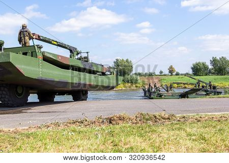 Minden / Germany - September 4, 2019: German Tank Pioneer Battalion Trained A Tank Crossing Over A R