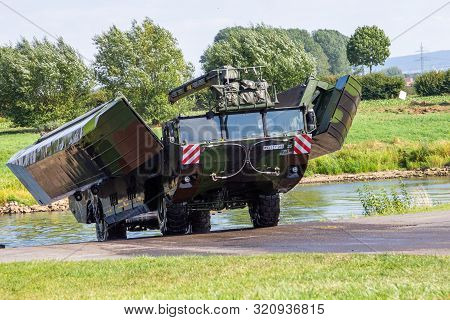 Minden / Germany - September 4, 2019: German Tank Pioneer Battalion Trained A Tank Crossing Over A R