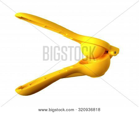 Manual Yellow Lemon Squeezer Isolated On White Background. Top View Of Lemon Squeezer.