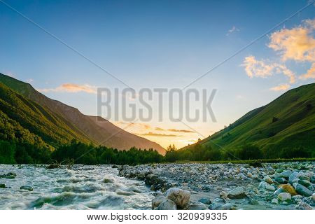 Svaneti Landscape At Sunset With Mountains And River On The Trekking And Hiking Route Near Mestia Vi