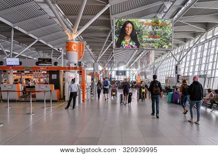 Warsaw, Poland - July 2019: Warsaw Chopin Airport Architecture And Passengers Inside. Warsaw Chopin 