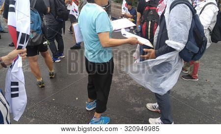 Seoul, South Korea; September 7, 2019:volunteer Trying To Get Signatures On Petition During Demonstr