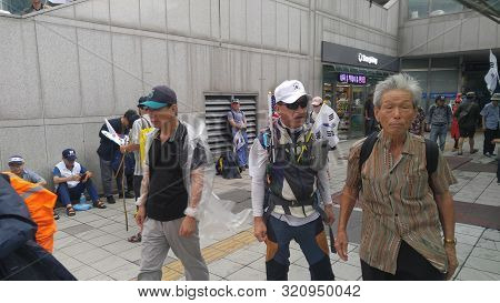 Seoul, South Korea; September 7, 2019:unidentified Men At Seoul Station Plaza During Protest Against